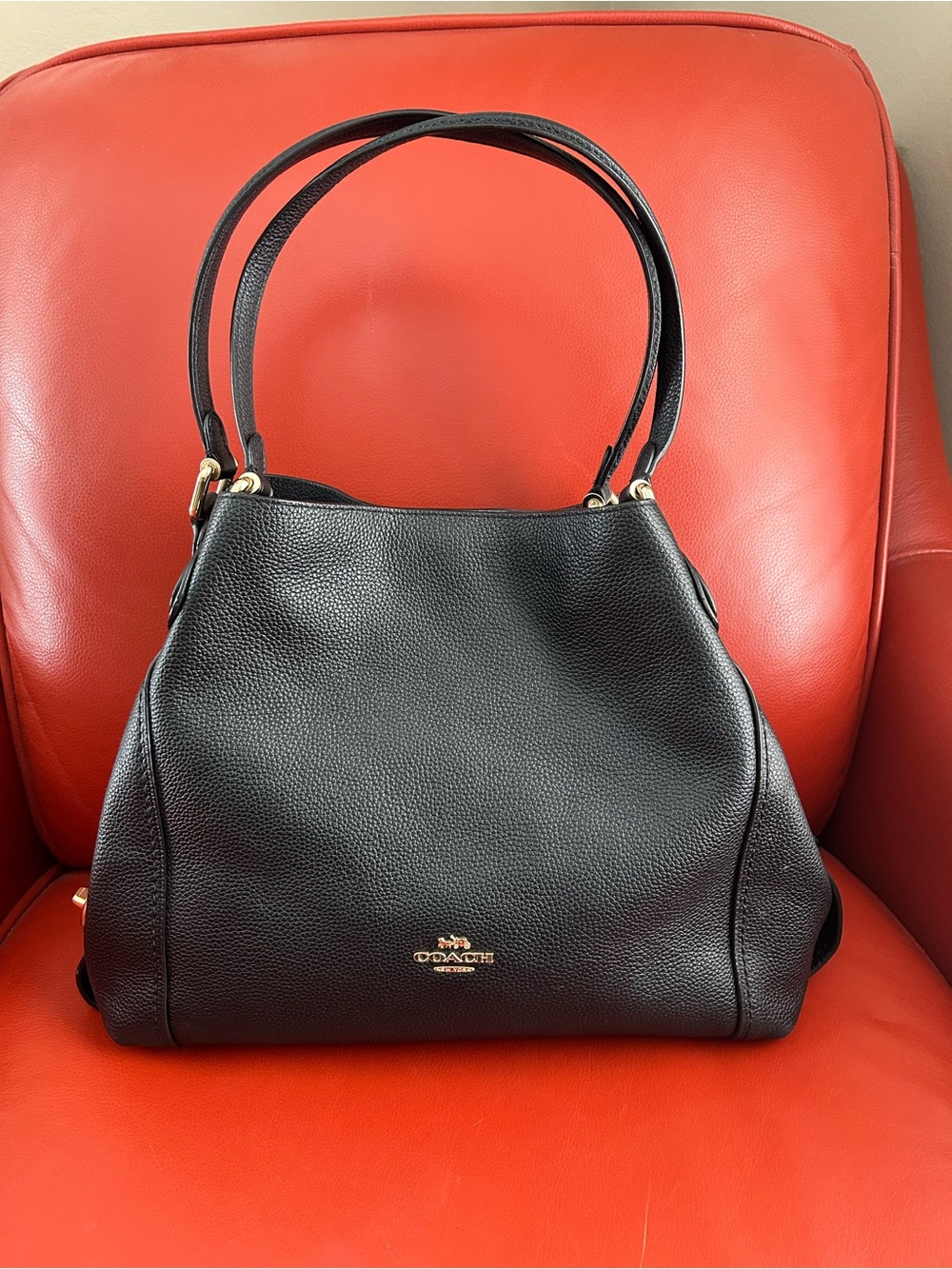 Coach Edie 57125 black pebble leather shoulder bag with gold hardware. Like new!
